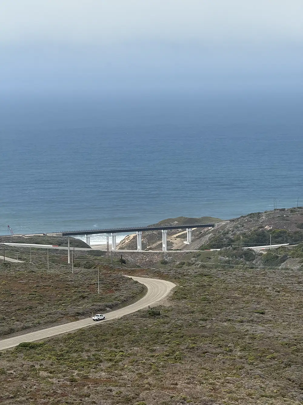 road and overpass by ocean